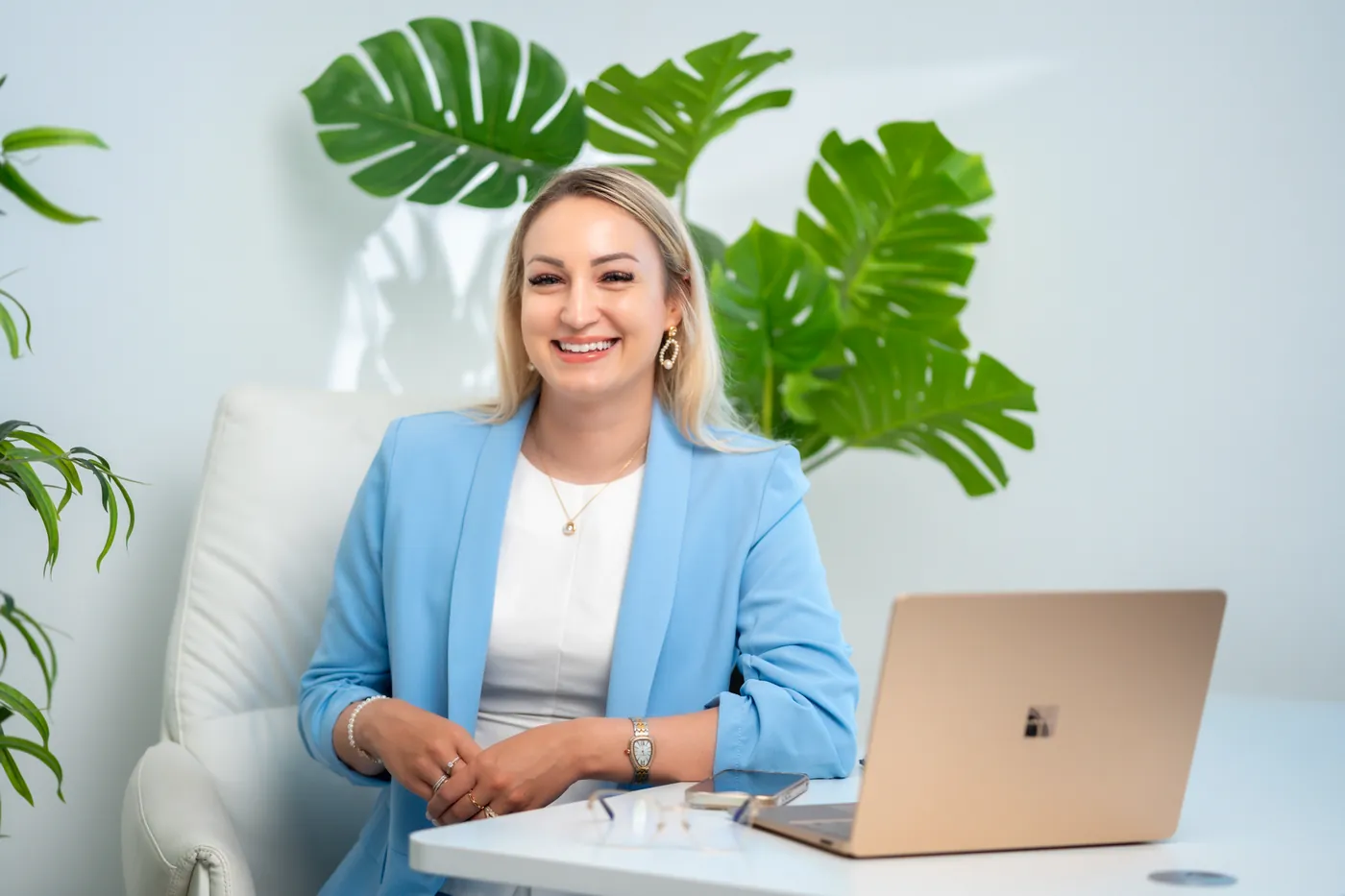 Adrienn, founder of The Hormone Method, smiling warmly in her sunlit studio.